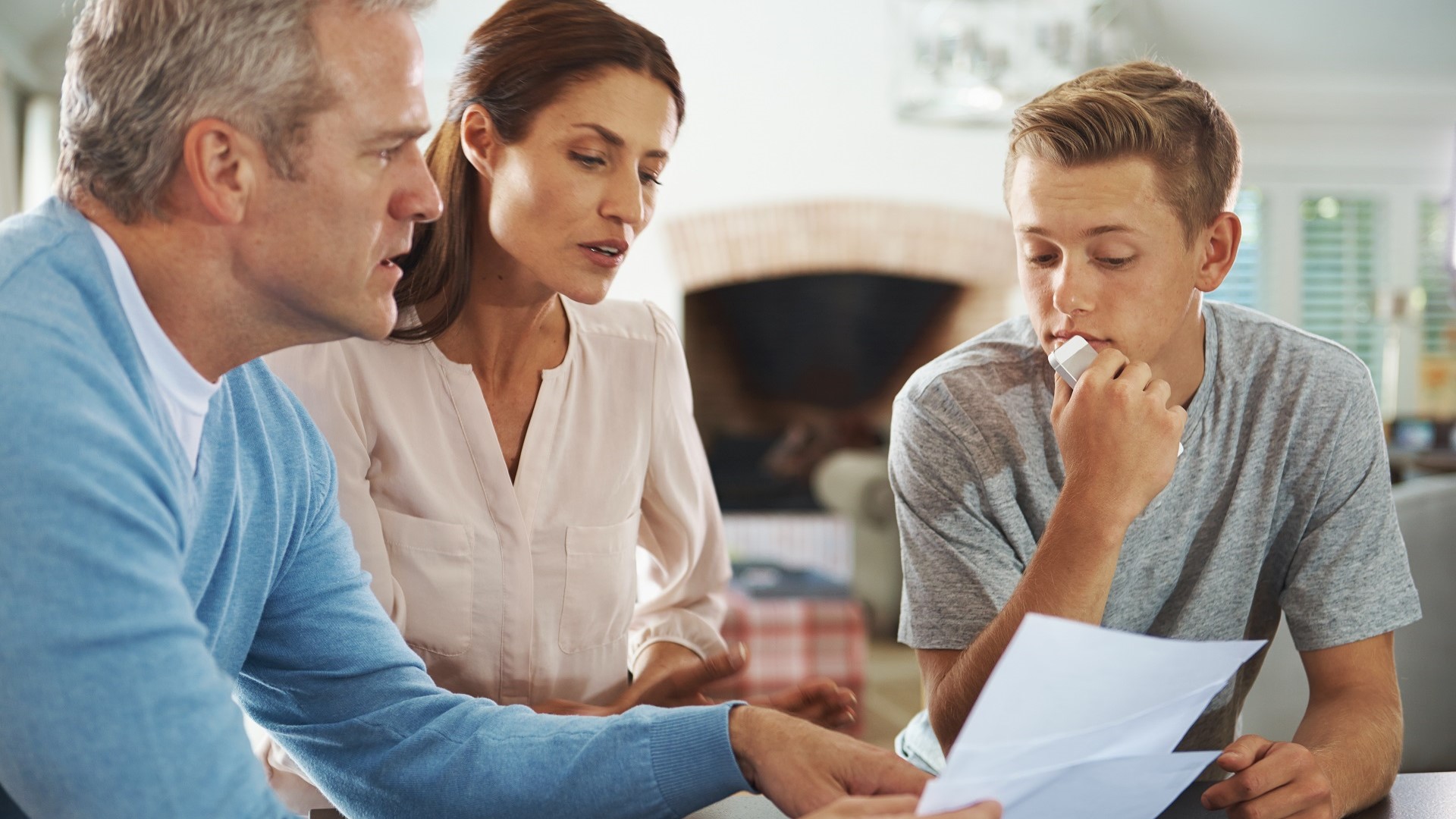 Parents review a test with their child.