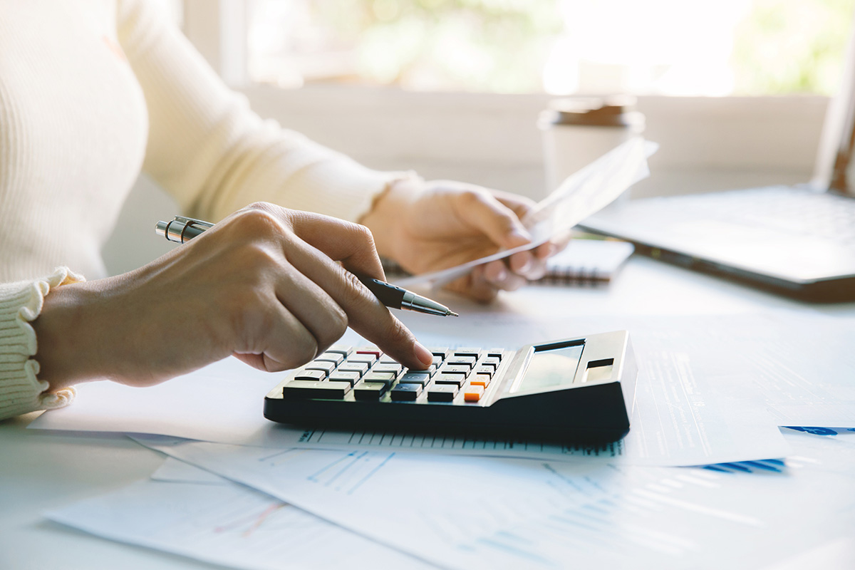 Women doing paperwork for paying taxes. (Photo: Adobe Stock │ #352198814 - Pcess609)